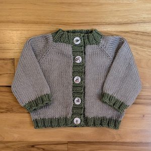 Beige Infant Cardigan with Green Trim and Kitten Buttons