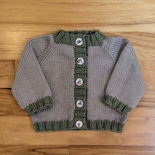 Beige Infant Cardigan with Green Trim and Kitten Buttons